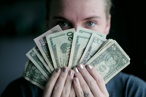 How to save money for travel - fan of money