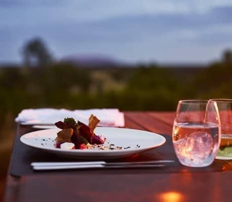 Enjoy champagne and canapes at tali wiru as you watch the sunset over uluru