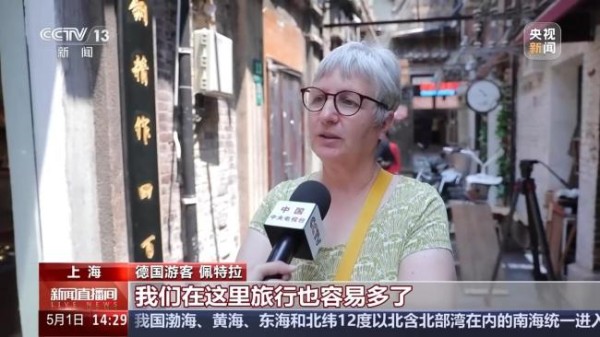 外国游客五一组团来中国买买买 入境游热度飙升