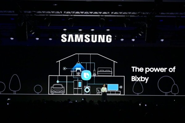 A person standing in front of a screen Description automatically generated