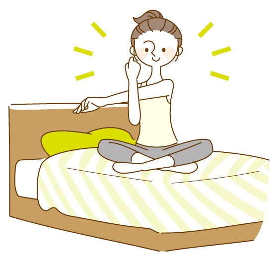 就寝前にベッドでストレッチする人