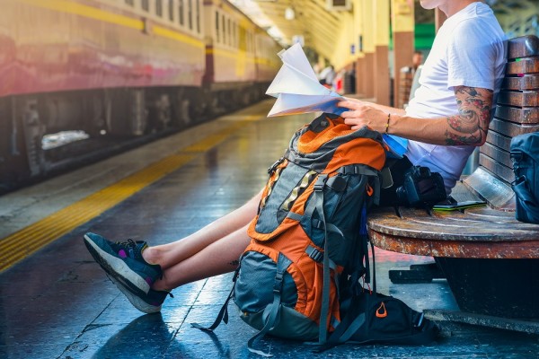 How to pack a backpack - orange backpack and map