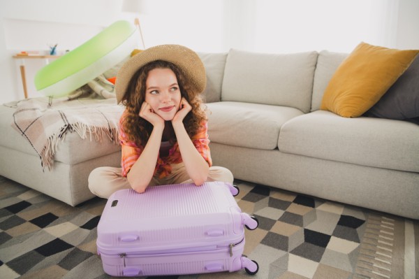Woman Packing for Solo Travel Trip