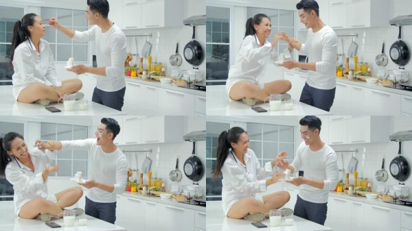 厨房里可爱的夫妇。夫妇在厨房生活方式膳食准备中烹饪健康食物