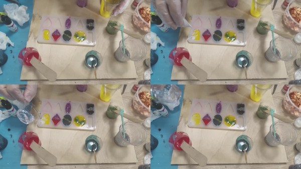 一个人在制作珠宝，使用环氧树脂填充装饰，模具中创作珠宝，手工制作，手工艺大师。