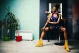 woman in black bottoms and pair of yellow chunky heels