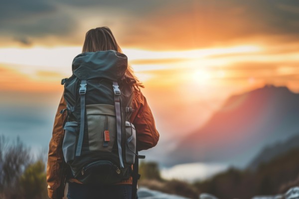 First Time Solo Travel Woman Looking at Sunset - Solo Travel tips