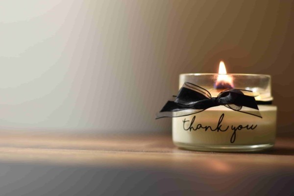 scented candles with a black bow