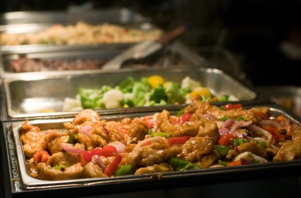 a close up image of a buffet with full of food