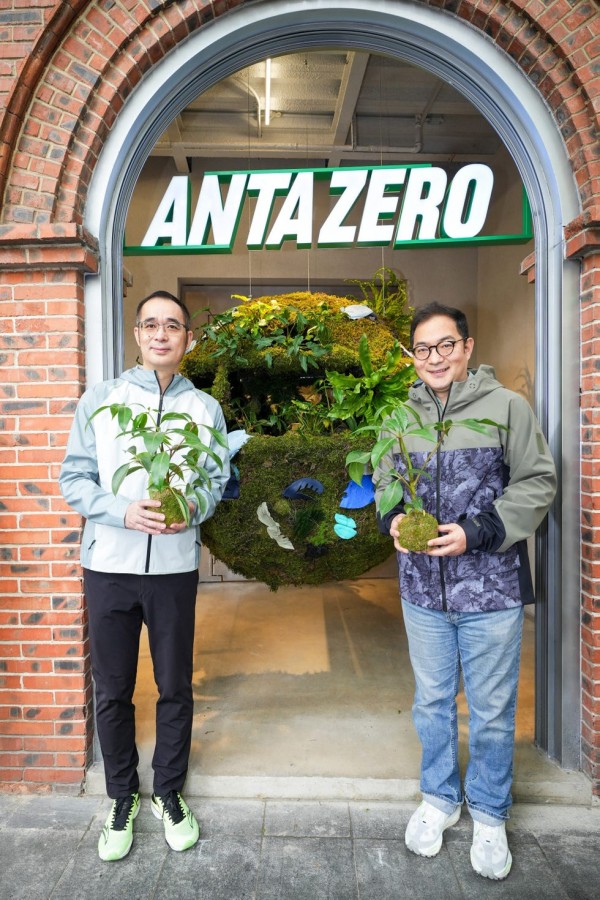two men standing in front of a door with a sign above it