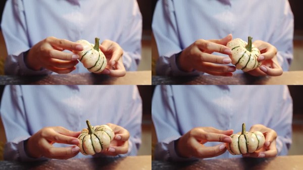 手握新鲜绿色条纹蔬菜，健康饮食或烹饪概念。
