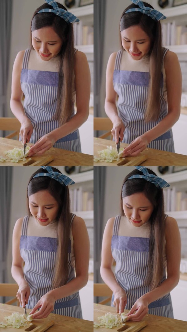 亚洲女性在厨房用炒锅烹饪，年轻女性在厨房准备食物。她展示了如何准备健康食品。清洁饮食和健康生活的概念