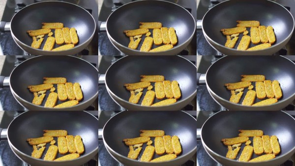 锅中用热油煎炸金黄色的天贝，少油烹饪。健康生活方式。