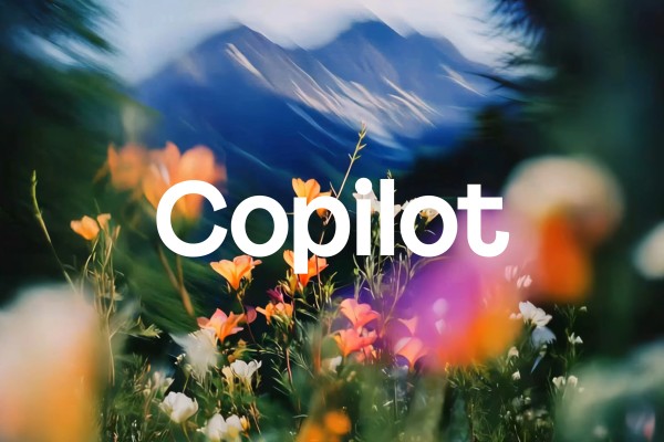 Wildflowers waving in the breeze with the word Copilot on top