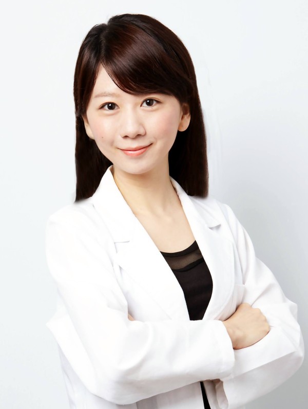 professional in a white lab coat with arms crossed exuding confidence