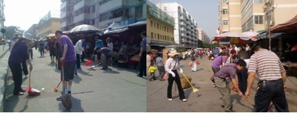 图为工业办同志在安吉办新世纪社区进行大扫除