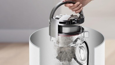 一键式弹射轻松倾倒灰尘