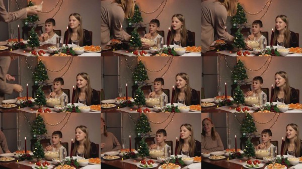 充满爱的母亲在节日装饰的桌子上为孩子们端上自制的圣诞晚餐，烛光闪烁，体现了节日庆祝中的温暖和家庭团聚