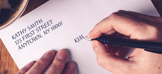 Customer addressing a letter.